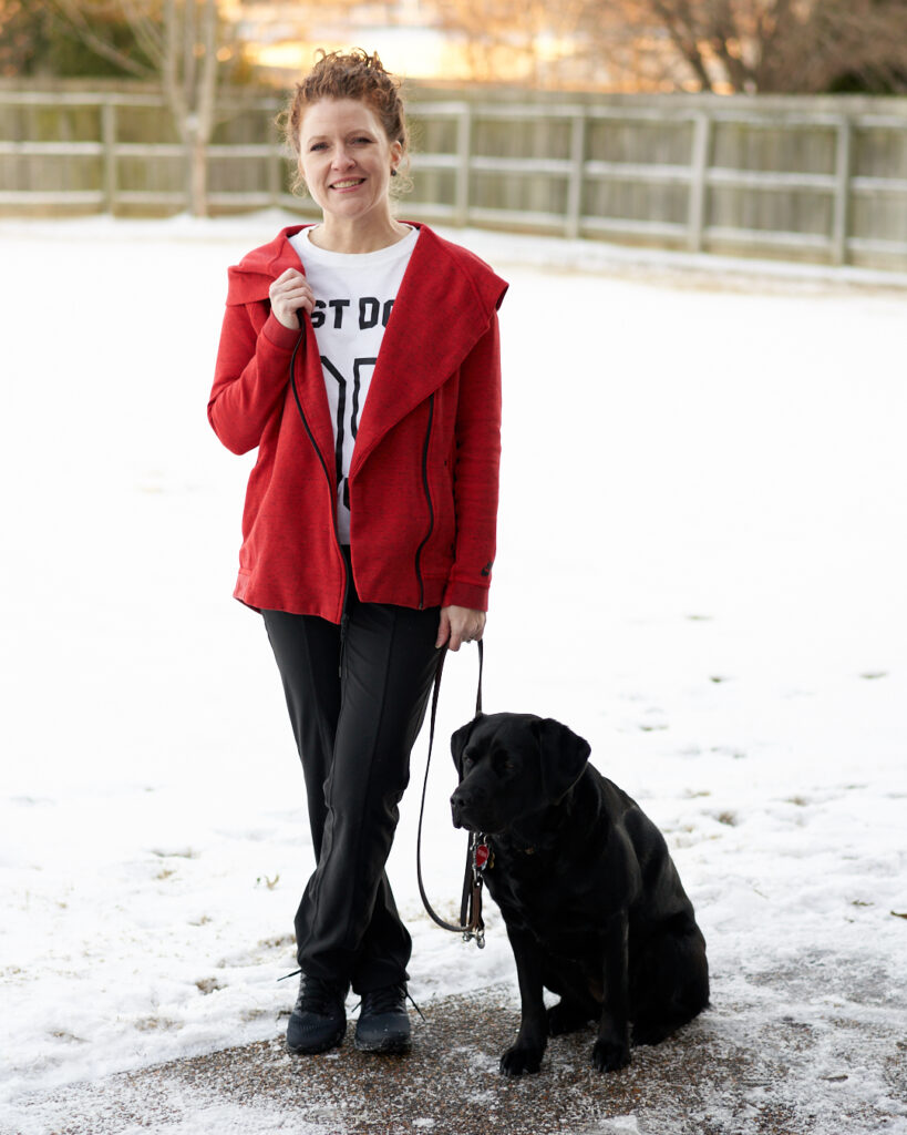 Jamie with Robin wearing Athleta Metro slouch pants, orange Nike hooded zipped jacket, Just Do It Nike t-shirt and Nike All Out Running Shoes