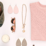 Flat Lay of Sweater, Shoes, Necklace, Candle and Sunglasses