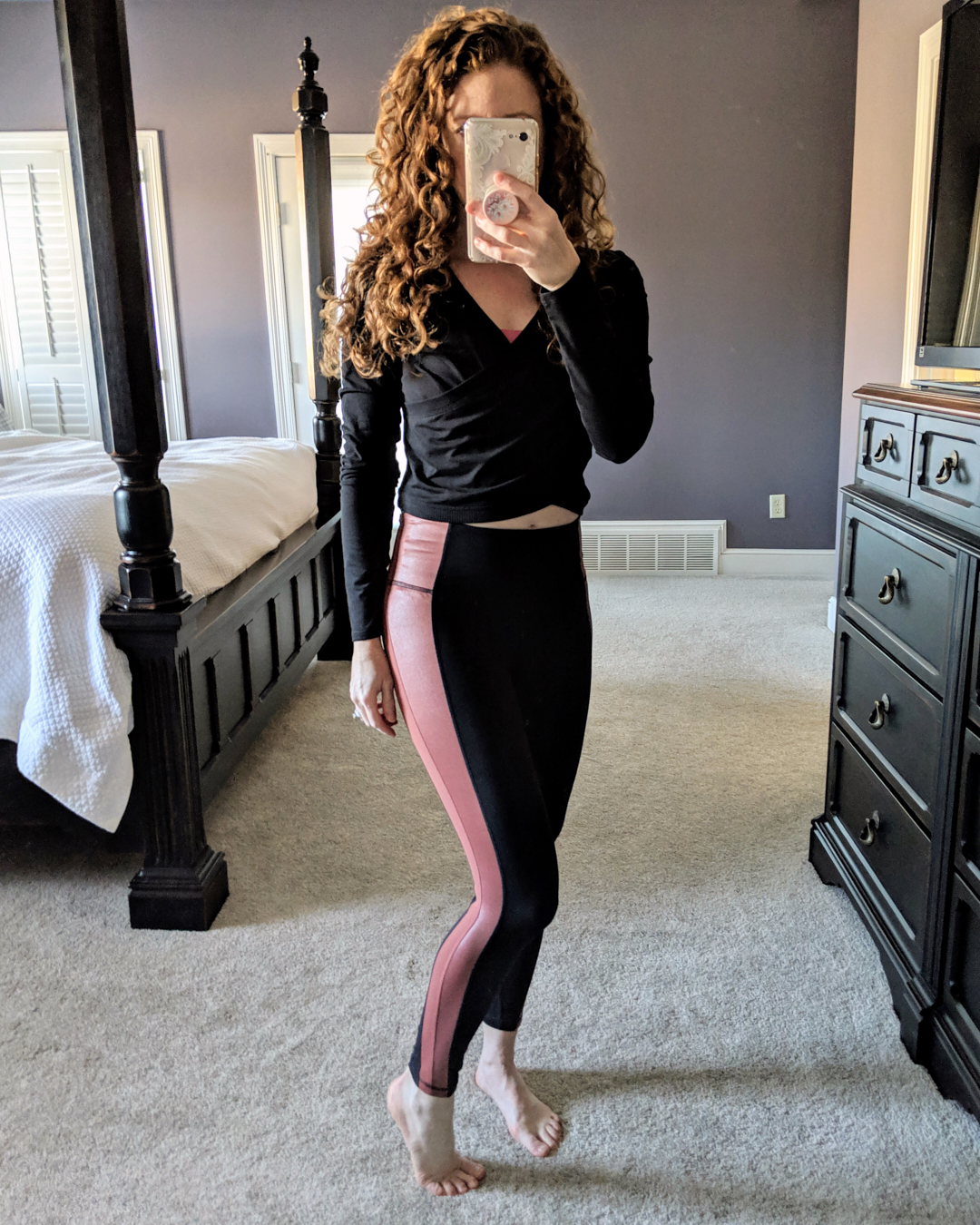 Mirror shot of Jamie in powervita leggings and wrap crop top