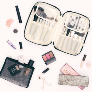 Photo of Makeup Brush Bag and makeup in a flat lay