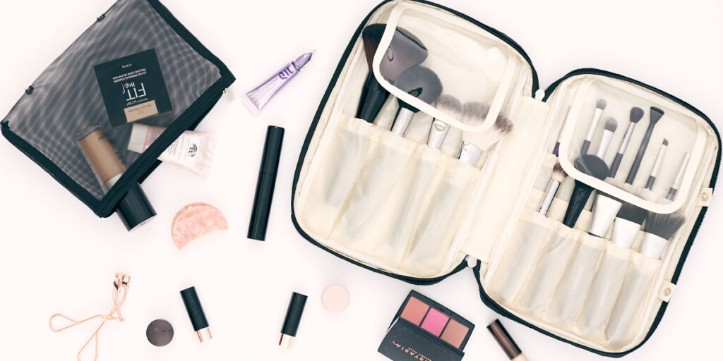 Flat Lay of Ellis James Desings Makeup Brush Bag and Makeup all around it