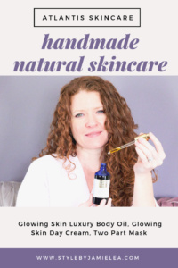 Me holding a bottle of Atlantis Skincare Luxury Body Oil