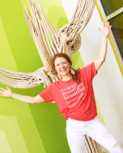 Me wearing a graphic tee that says beautiful outside of the Saguaro Hotel