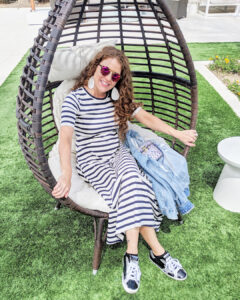 Jamie Sitting in a swing chair at Hotel Adeline in Arizona
