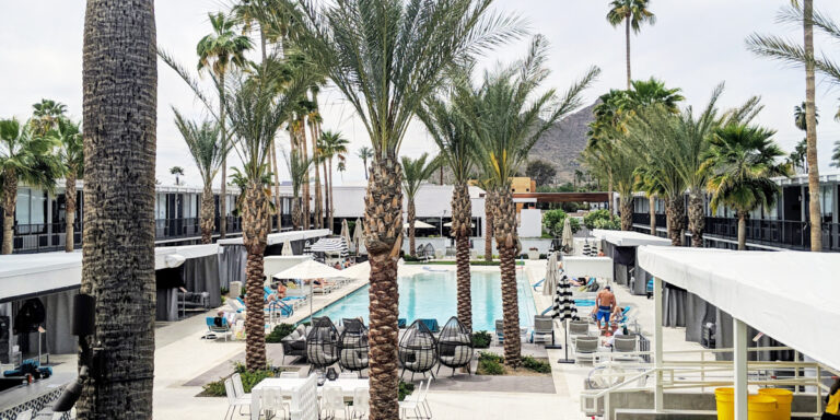 Image of pool are of Hotel Adeline with Camel Back Mountain in the background with palm trees!