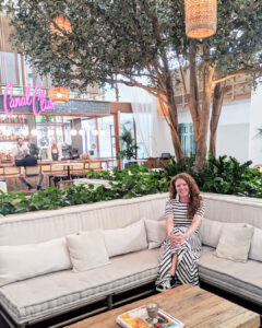 Jamie sitting in the lobby at The Scott Resort and Spa