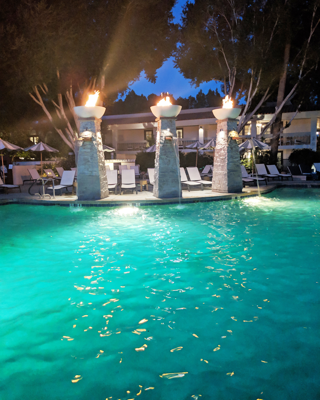 Photo of the water falls at the pool of the Scott Resort and Spa at night