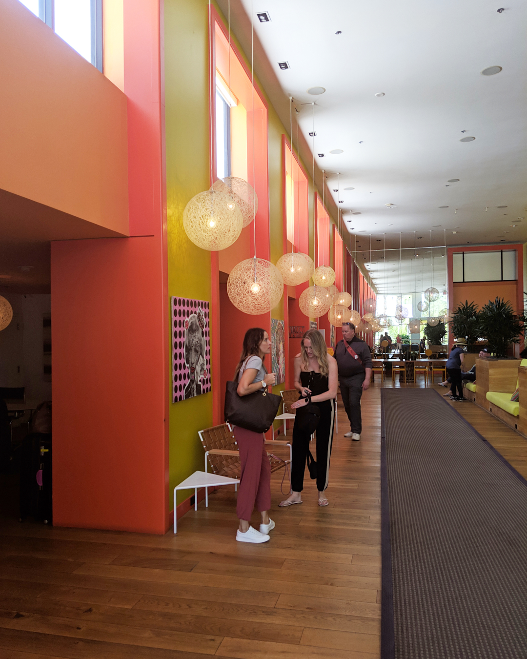 Photo of Jennifer and Erika inside in the lobby of the Saguaro Hotel