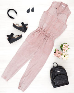 Flat Lay photo of pink jumpsuit, Brahmin Backpack, pearl headband, Nickel and Suede Earrings and OTBT Bushnell wedges